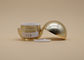 Os recipientes de creme cosméticos da forma da bola, composição vazia do círculo do ouro rangem